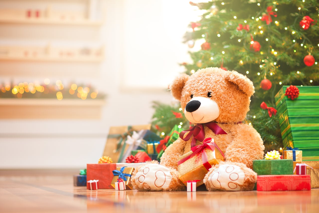 Christmas gifts under christmas tree in the sunny morning.